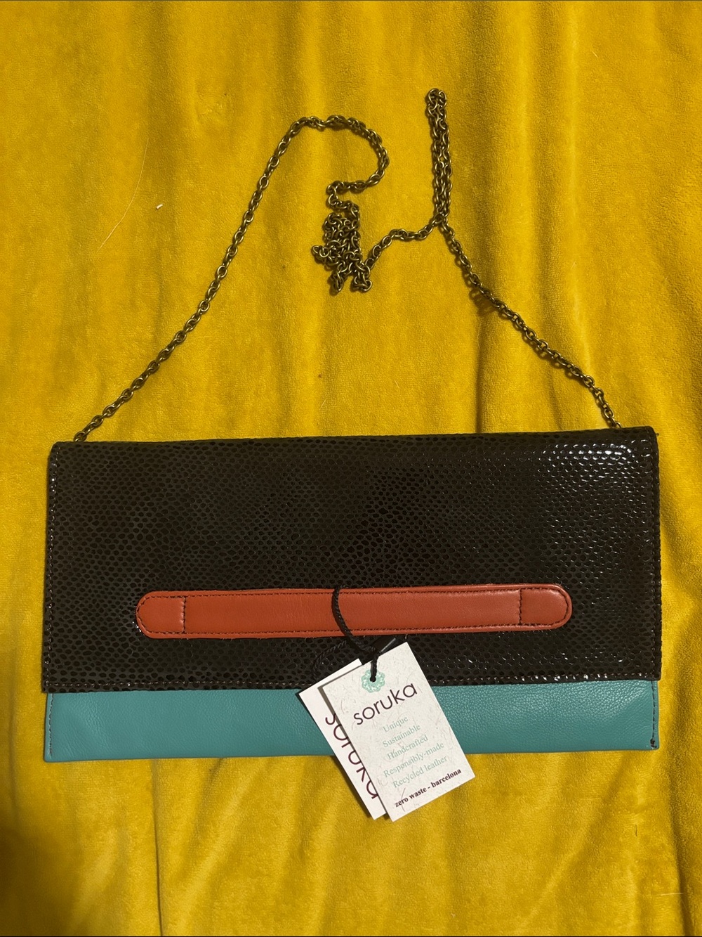 Soruka Black & Teal Leather Crossbody Clutch with Brown Accent